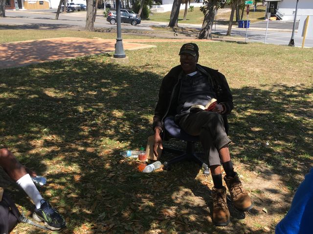 A veteran shares a meal in the park