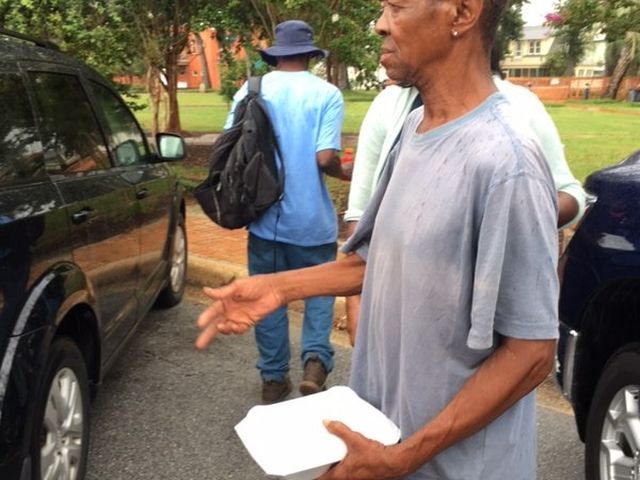 Serving a meal to a community member