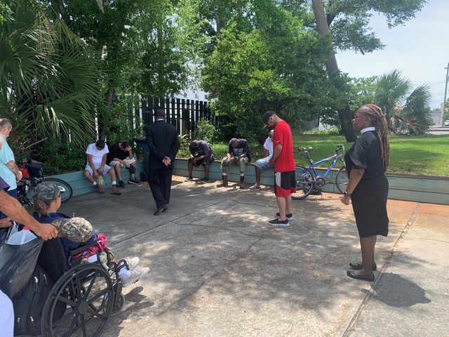 A prayer circle with neighbors
