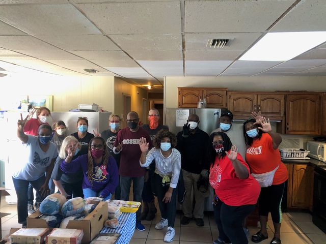 Goshen volunteers together at a food drive
